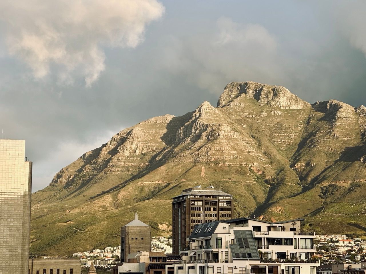 Table Mountain rising above the Cape Town city bowl at golden hour